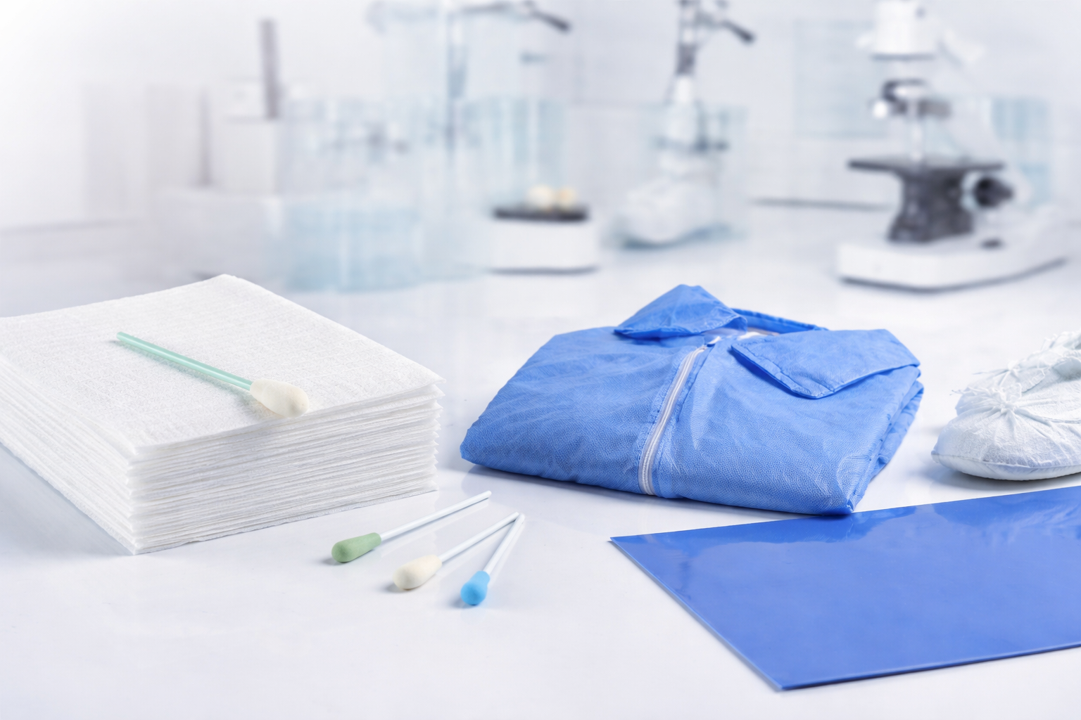 cleanroom supplies for contamination control including wipers swabs coveralls and tacky mats